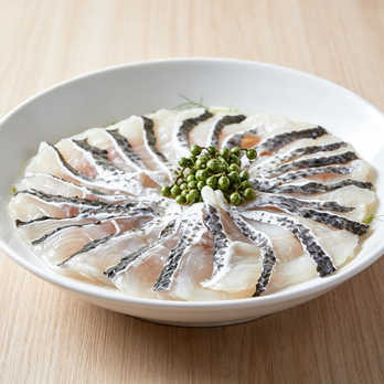 Elegant Sashimi-Style Fish Platter with Fresh Peppercorns